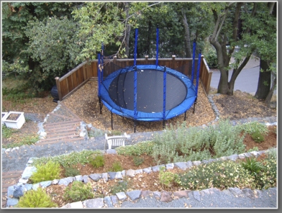 After: Looking down the hill and at the very fun trampoline.